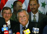 Iraq's new President Jalal Talabani smiles as he talks to the press following a meeting by the National Assembly in which he was voted in along with two deputies 06 April 2005, in Baghdad's fortified Green Zone. Iraq's parliament chose former Kurdish rebel fighter Talabani as the first freely elected president in its history, paving the way for the creation of a new government next week. AHMAD AL-RUBAYE / AFP