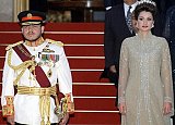 Jordan's King Abdullah II and his wife Queen Rania arrive at a reception to mark his formal ascension to the throne, at Raghadan palace in Amman 09 June 1999. Abdullah became king after the death of his father, King Hussein, 07 February 1999. JAMAL NASRALLAH / AFP